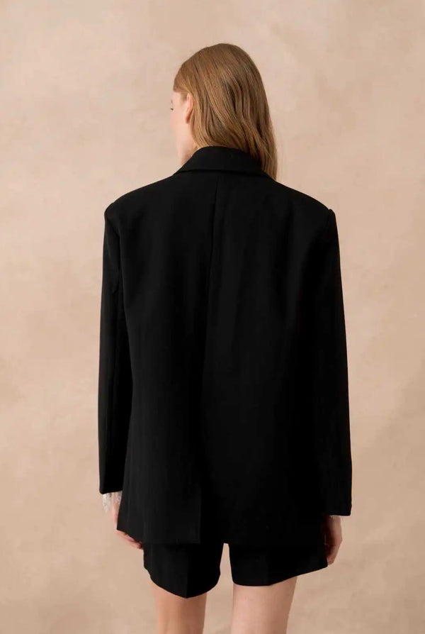 Blazer oversize noir avec poches à rabats